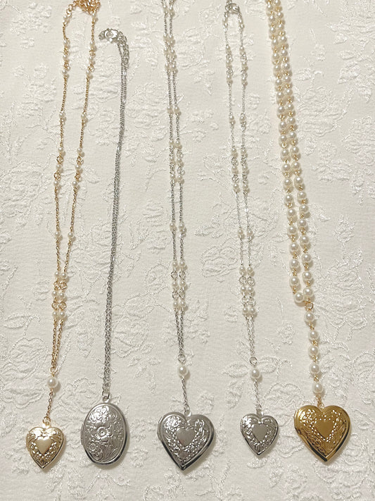 Gold and silver mixed collection of coquette chain and pearl locket necklaces, heart shaped, over shaped, small and large 