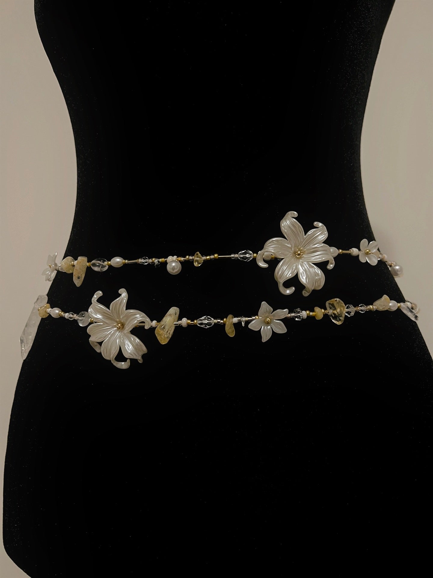 Handmade floral waist beads with pearl and crystal accents, elegant boho accessory for women